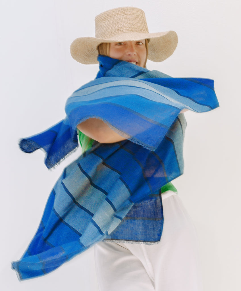 Shoo for Good's insect-repellent scarf in Blue Waves stripes repels ticks and mosquitoes. The undulating blues makes this scarf great for all genders. Insect Shield permethrin is bound to the fibers of the cotton scarf and is effective for 70 washings. Invisible tick protection. An Oprah favorite for DEET-free protection.