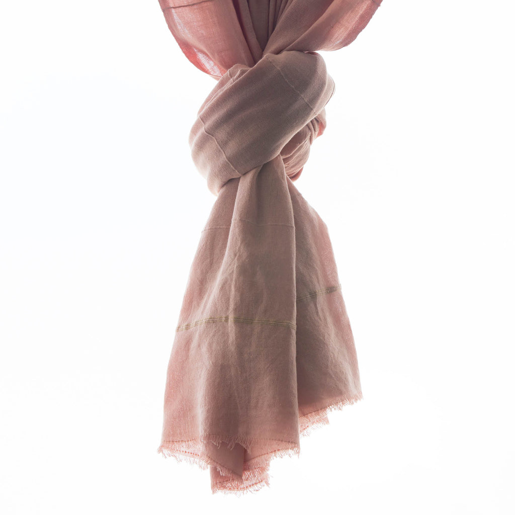 A detail photo of our tick-repellent and mosquito-repellent Shoo for Good Camellia shawl in blush, a lovely pink hue. Insect Shield permethrin is bound to the fibers of the cotton scarf and is effective for 70 washings. Invisible tick protection. An Oprah favorite for DEET-free protection.
